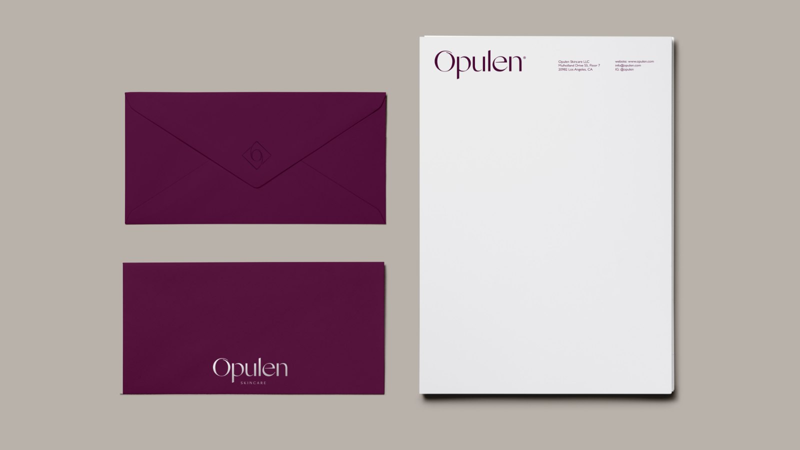 Opulen envelope, business card and letterhead on greige.